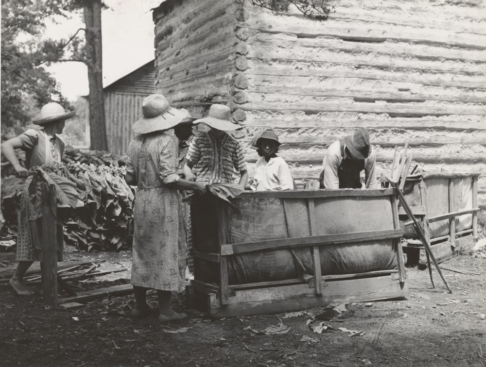 group of people cleaning outside house