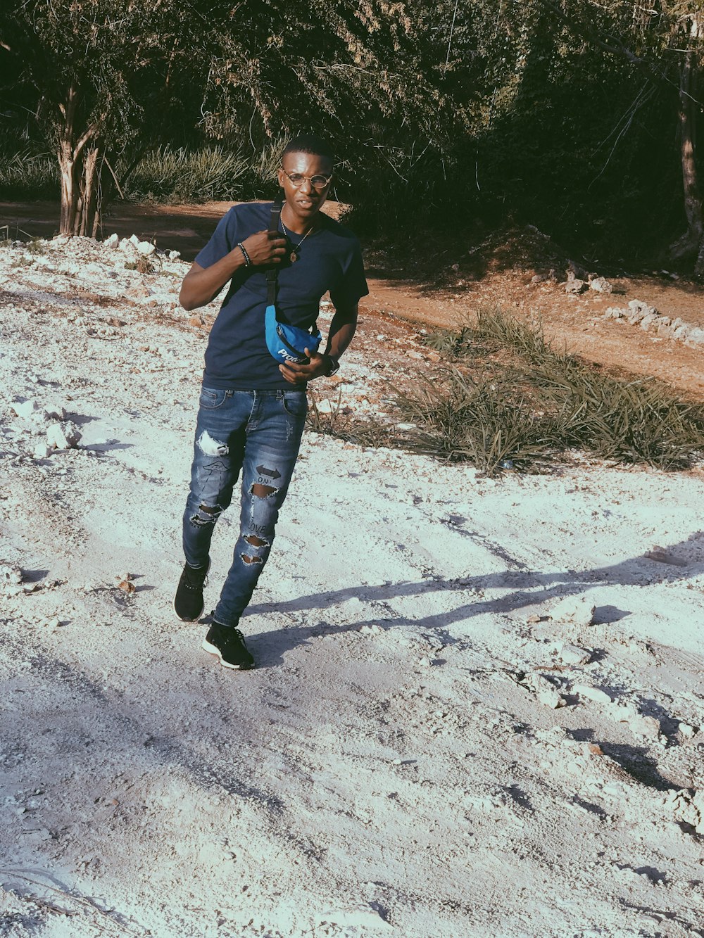 man walking on sand