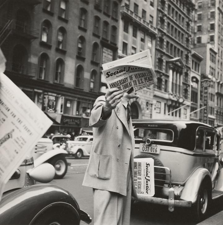 grayscale photography unknown person holding newspaper