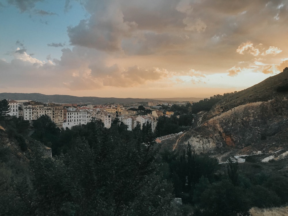 a view of a city from the top of a hill