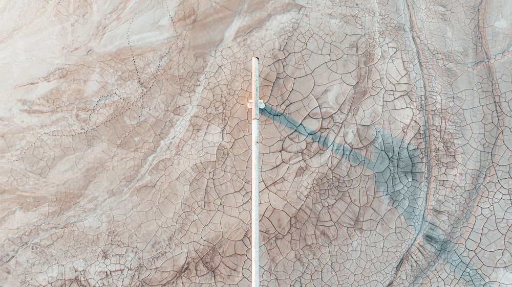 an aerial view of a street light in front of a mountain