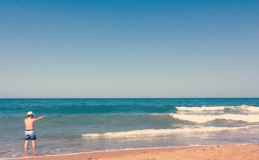 person on seashore during daytime