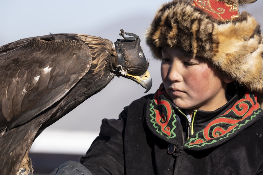 girl with hawk on his arm