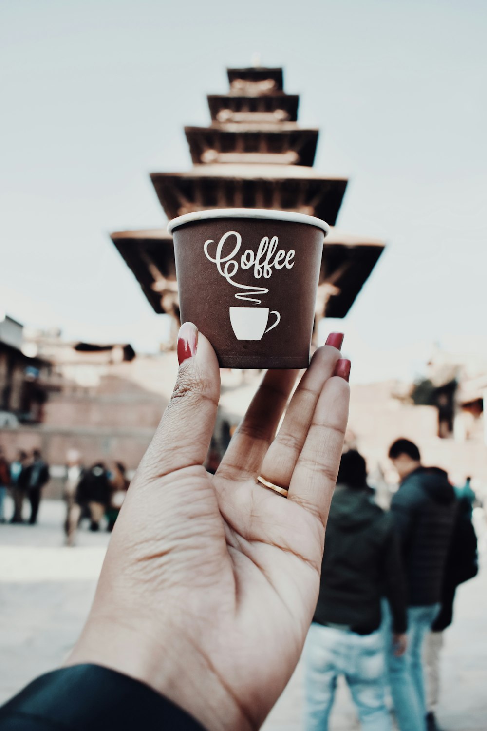 woman holding coffee cup