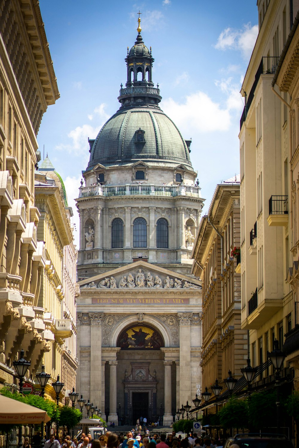 people in the street surrounded with buildings