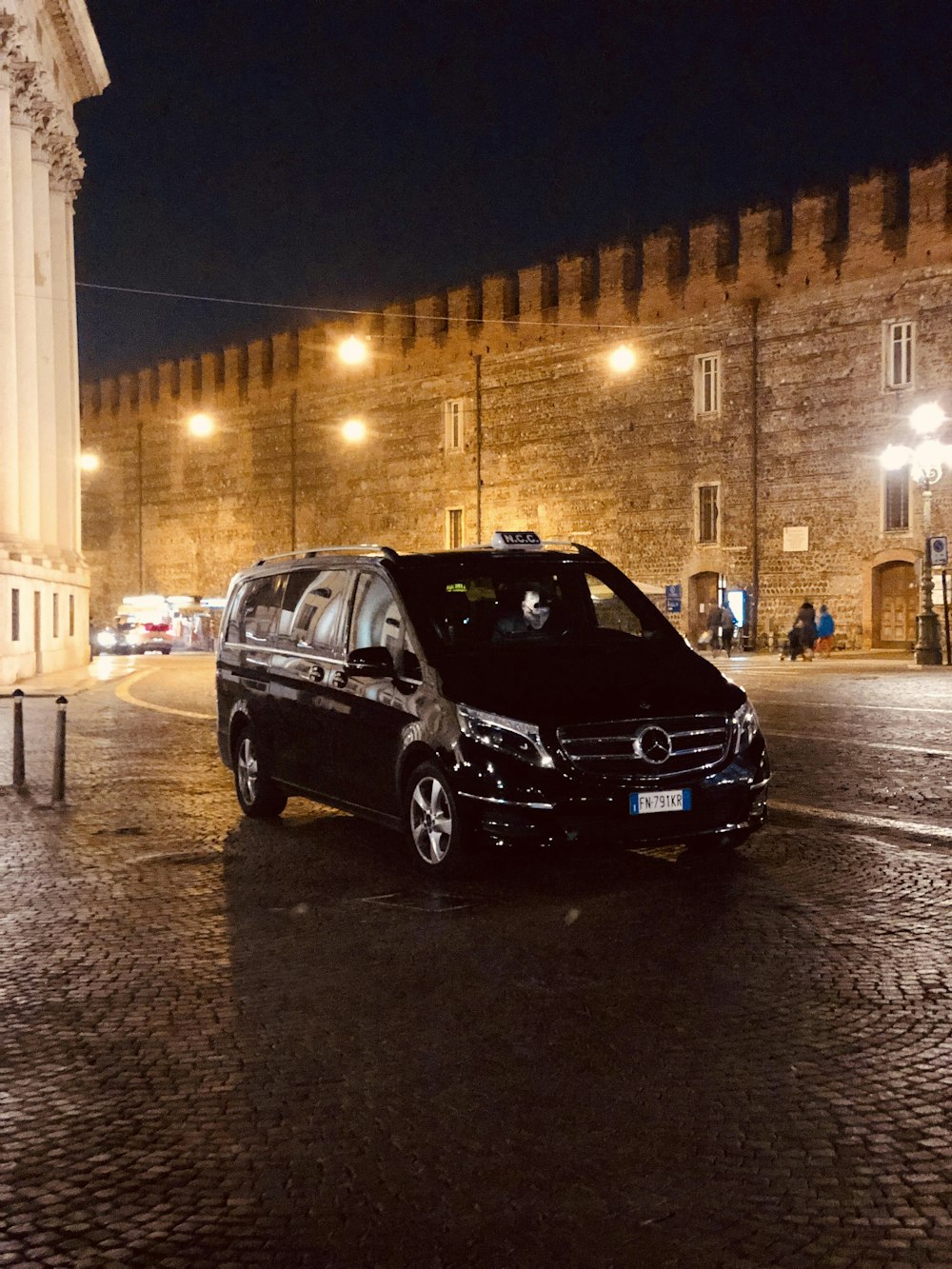 black minivan on road during nighttime