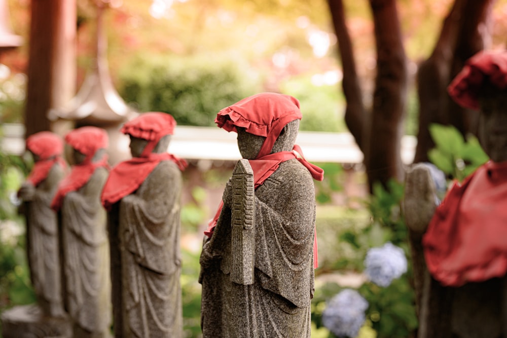 statues with hats