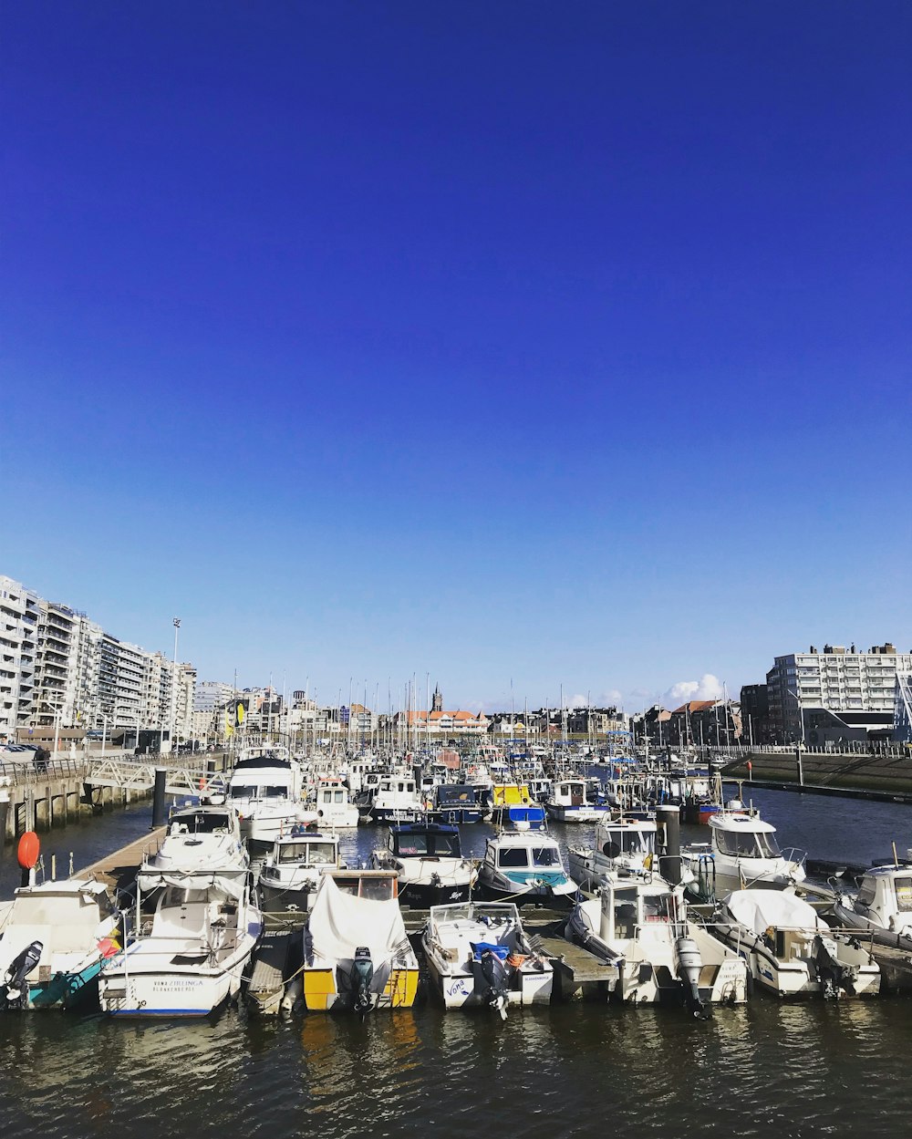 white boats during daytime