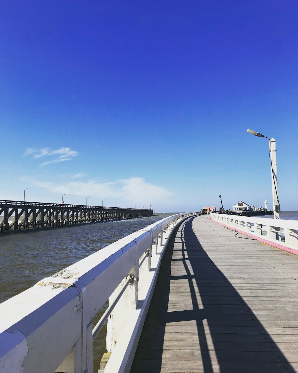 brown wooden dock at the sea during daytime