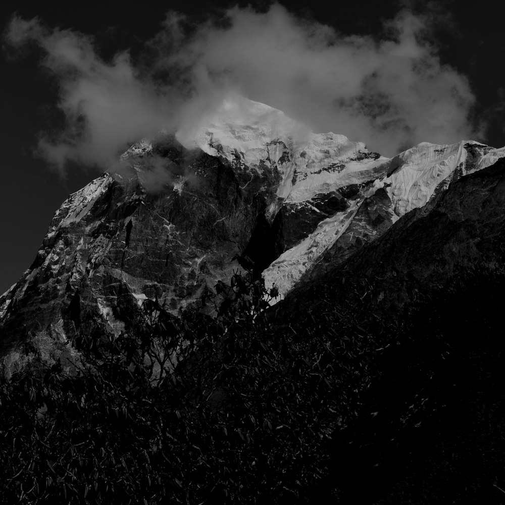 grayscale photo of snow=covered mountain