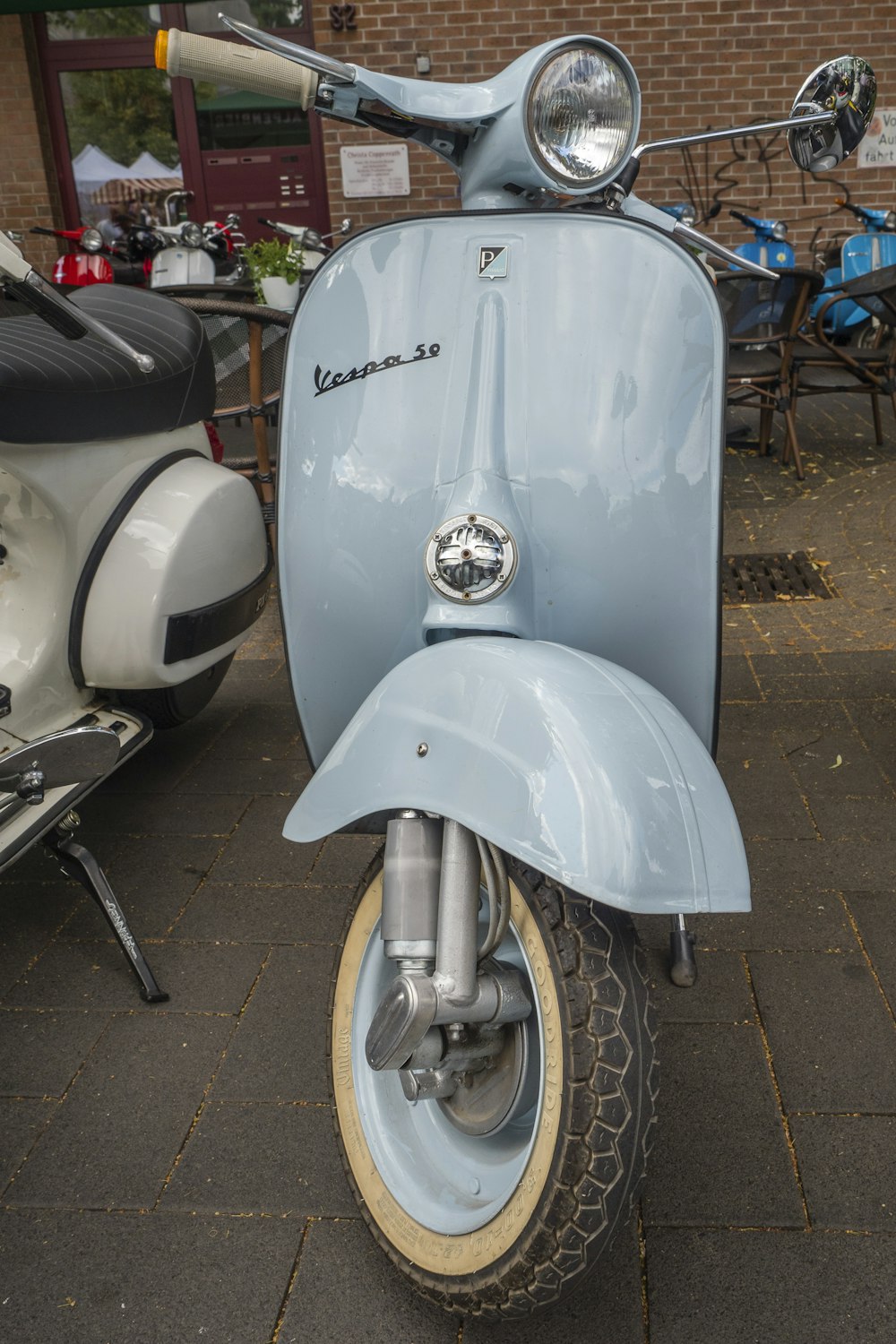 grey Vespa motor scooter