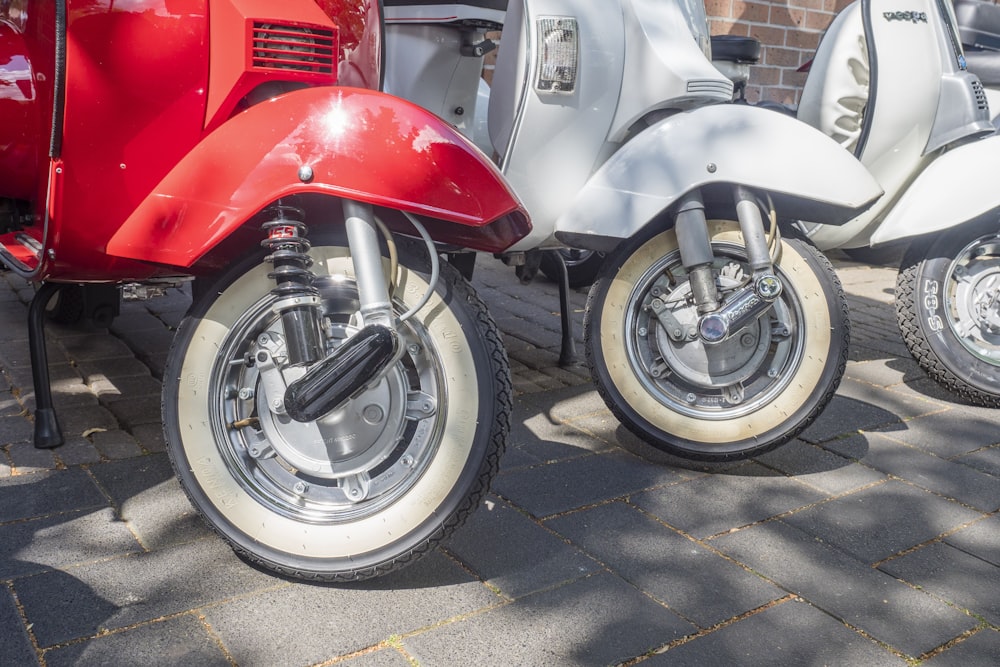 white and red motor scooters