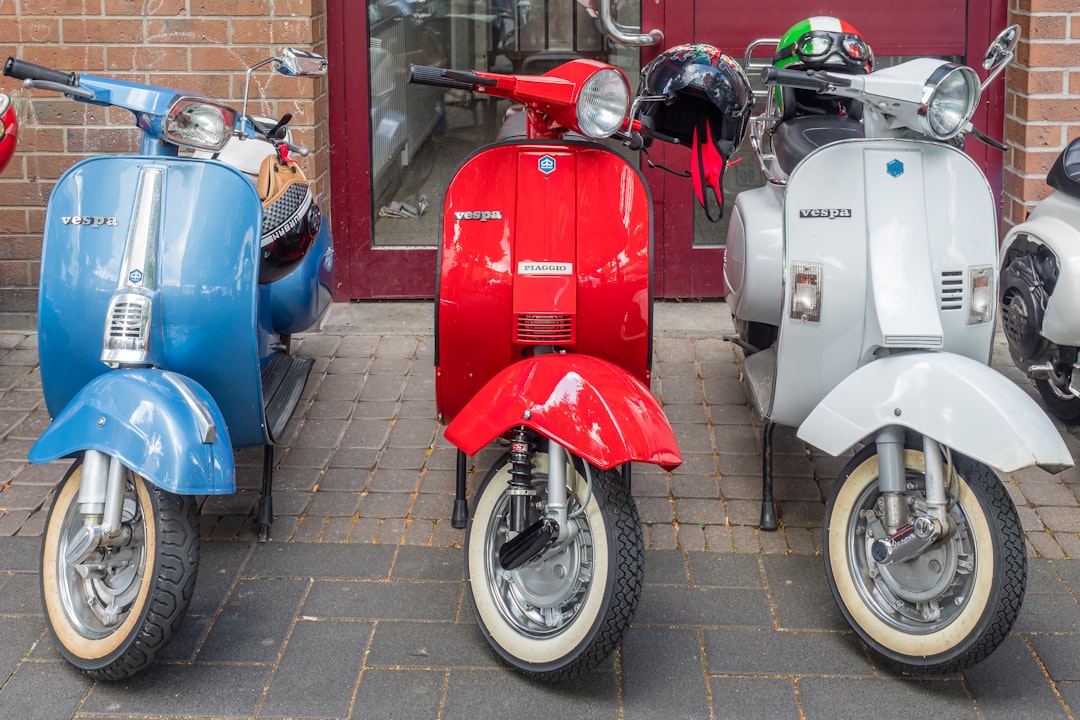 three motor scooters