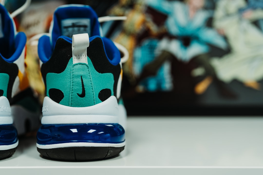 pair of teal-and-blue Nike shoe