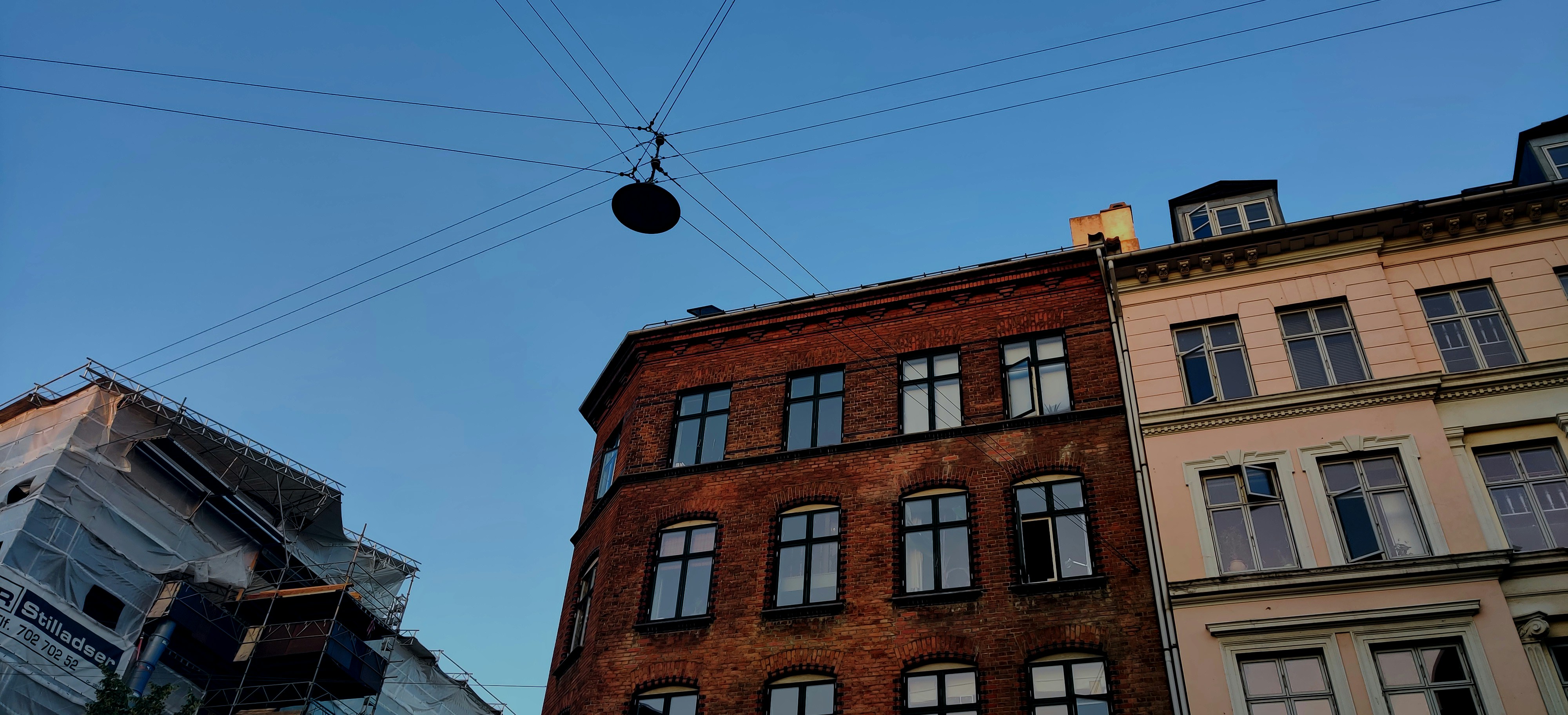 low-angle photo of buildings, Just a typical street in Copenhagen. 