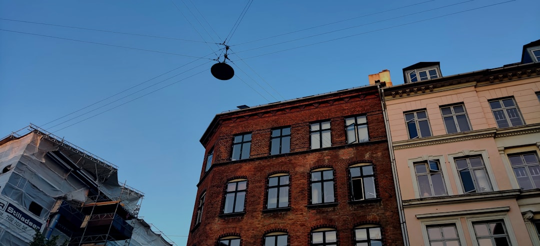 low-angle photo of buildings, Just a typical street in Copenhagen.
