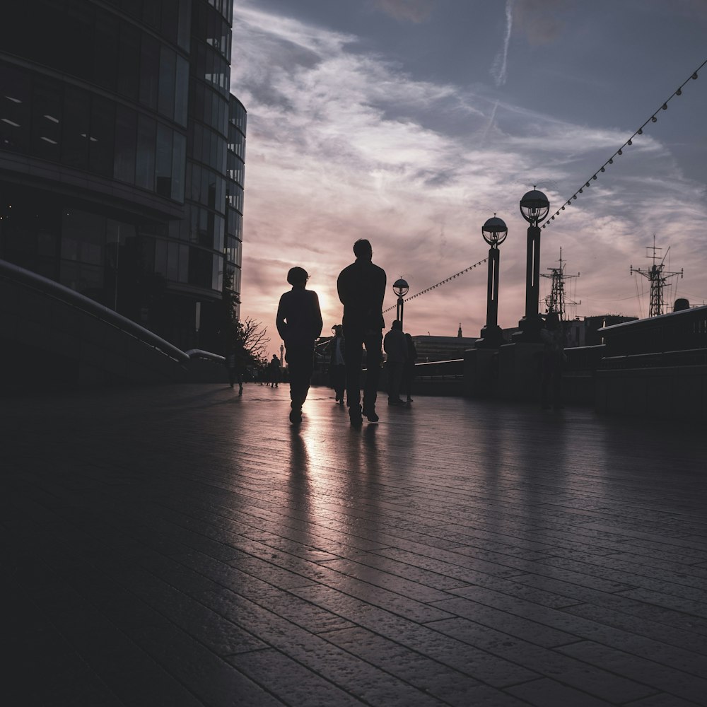 silhouette of two person standing