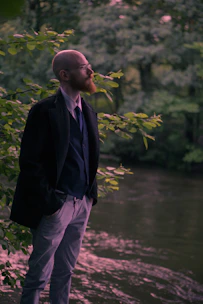 man standing near river