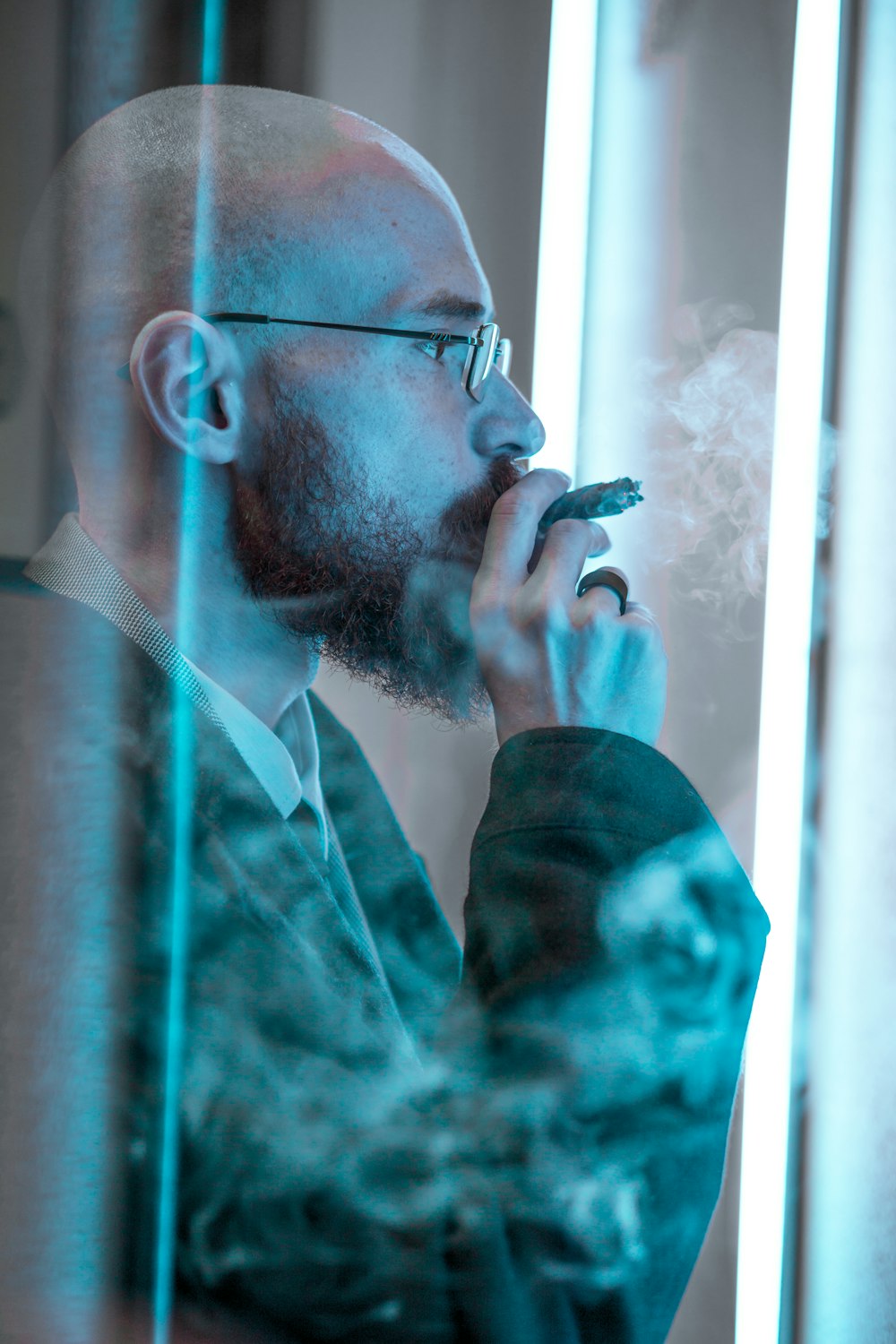 man smoking inside room