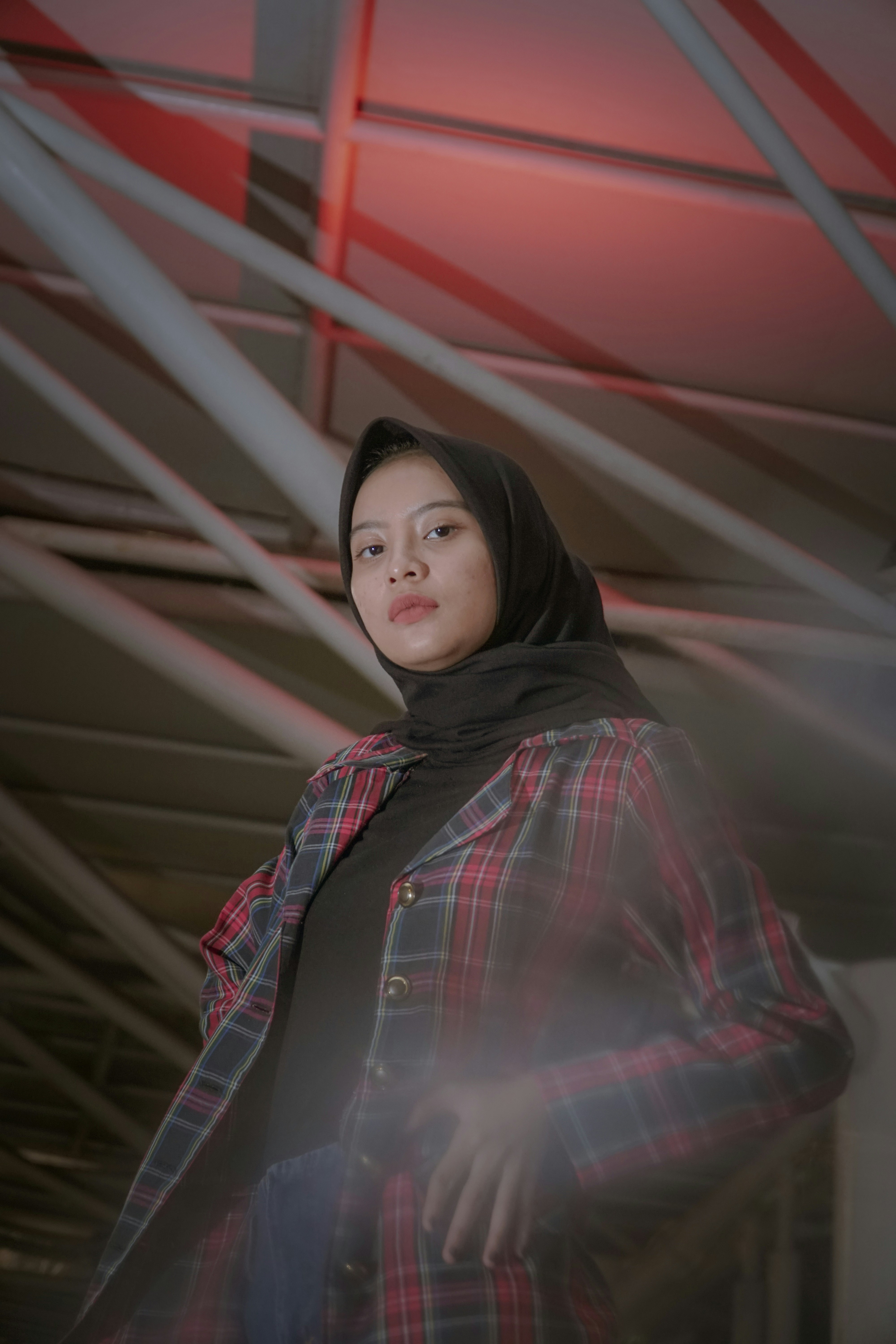 woman wearing red and black plaid coat