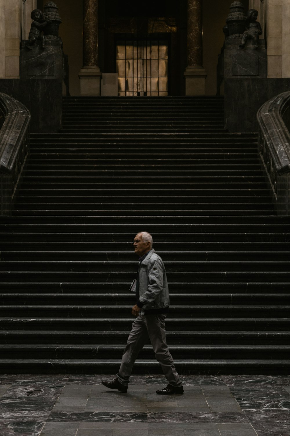 person near a black stairs close-up photography