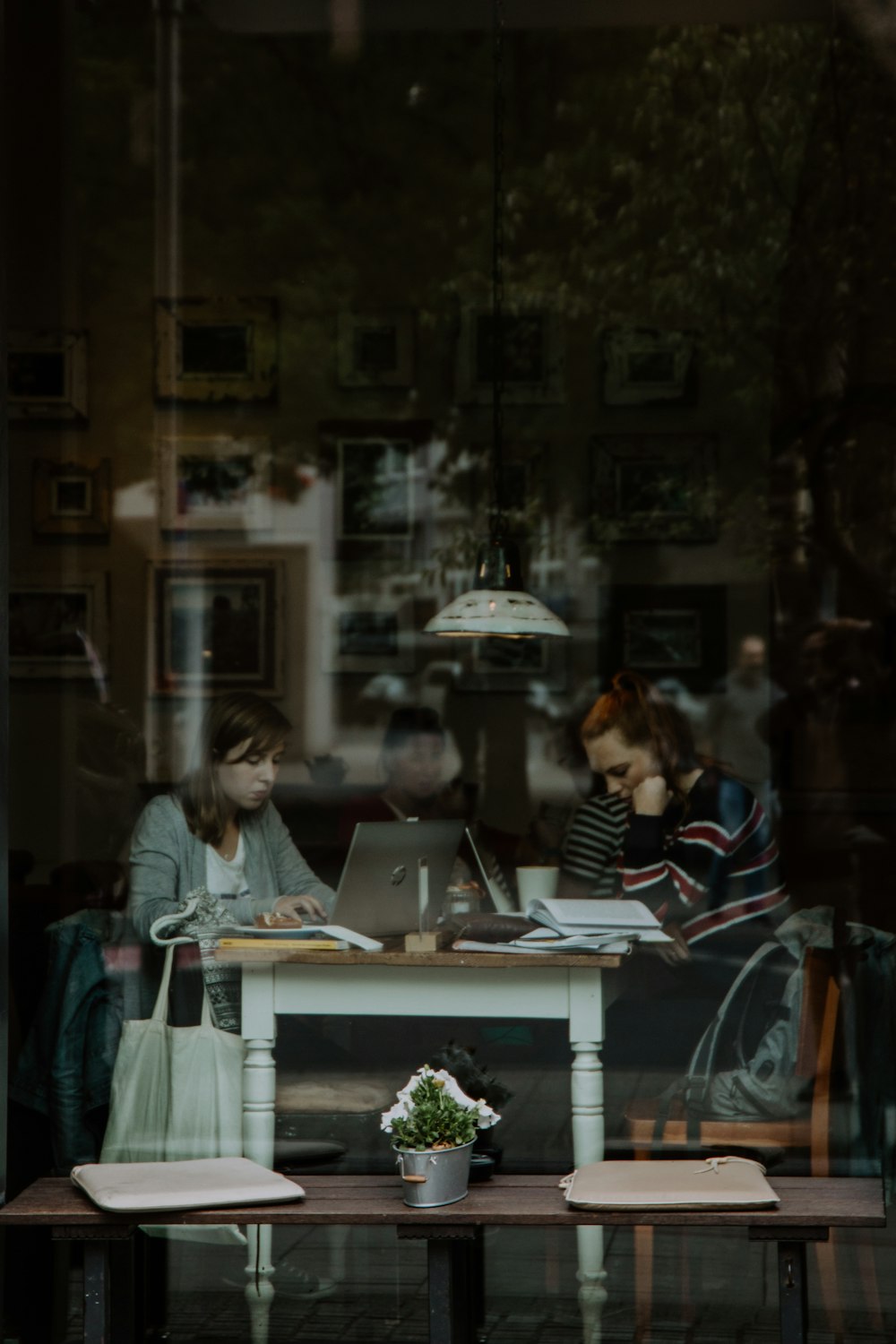 two women sitting around table