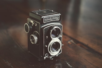 black and gray camera on table