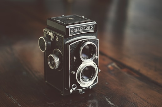black and gray camera on table
