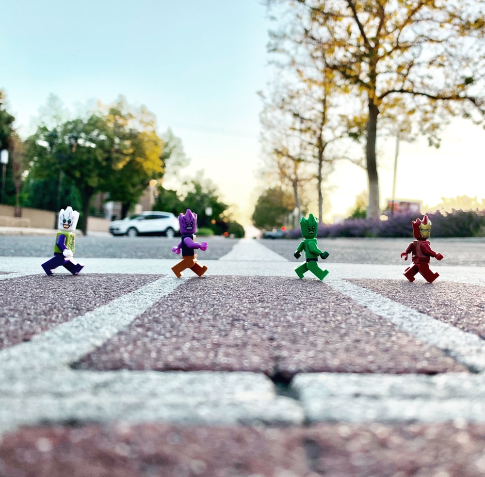 plastic toys on road on focus photography