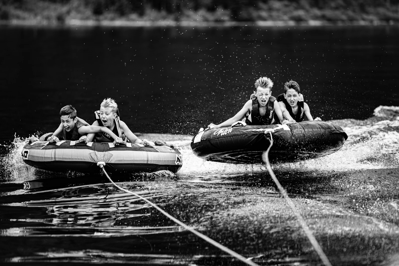 Kids floating on inflatable tubes inside an indoor waterpark in the Poconos