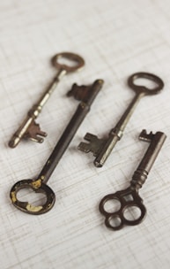 four brass skeleton keys