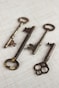 four brass skeleton keys