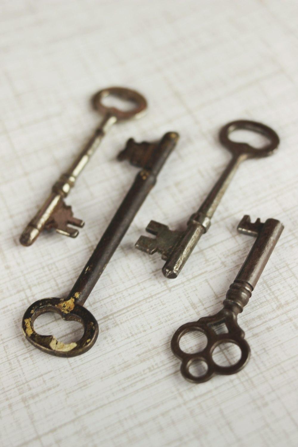 four brass skeleton keys
