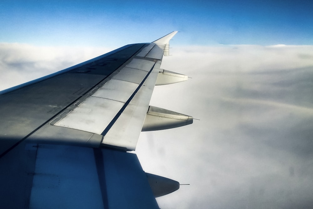 gray flying plane during daytime