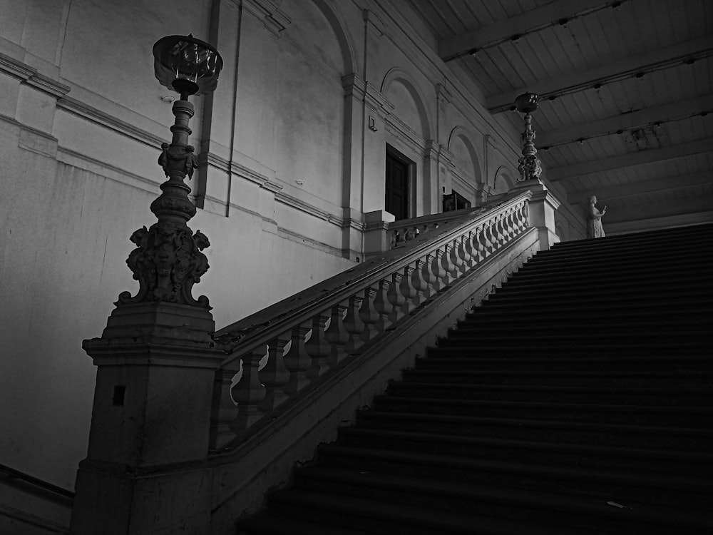 architectural photography of white stair handrail