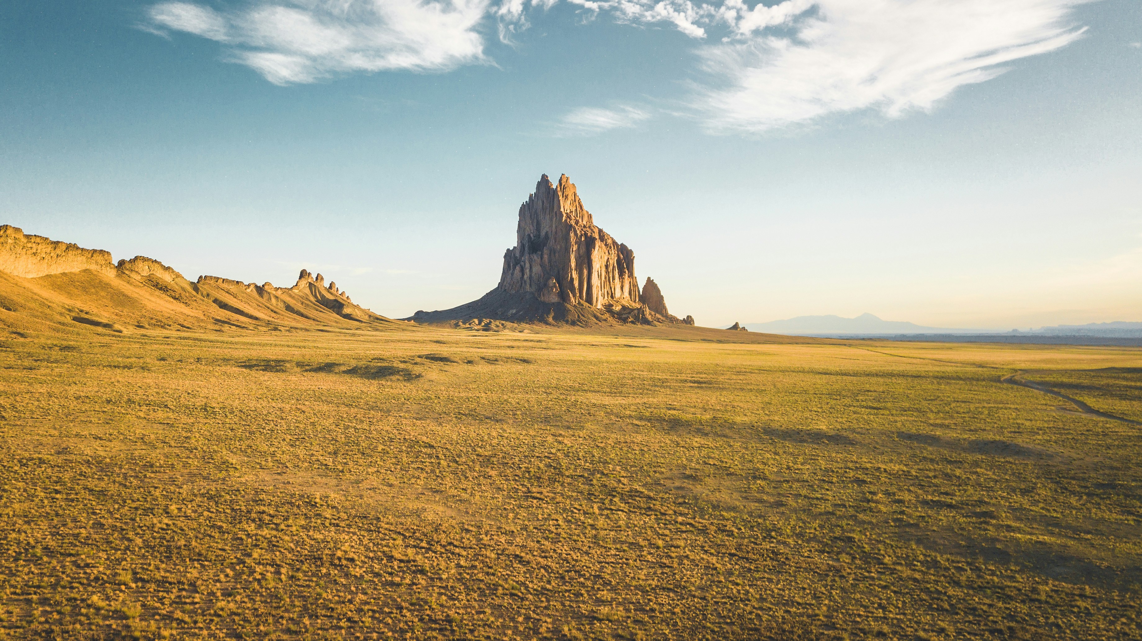 rock mountain under white clouds, 