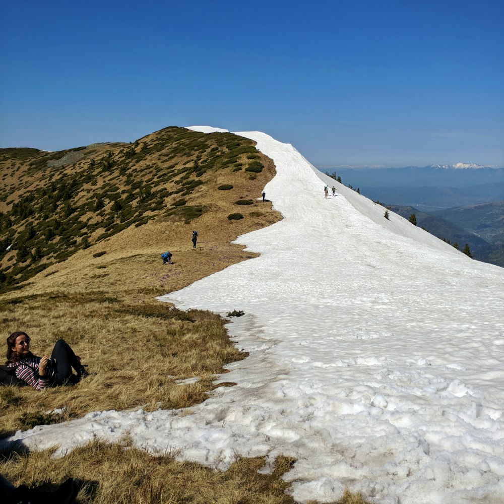 people walking on cliff during daytime