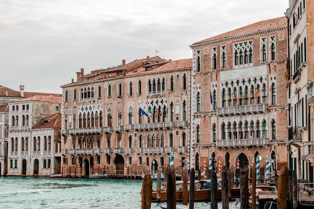 beige buildings in canal