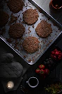 six brown patties in stainless steel baking pan
