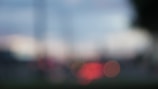 The image features an abstract and out-of-focus scene with soft, blurred circles of light against a muted background, evoking a dreamy atmosphere.