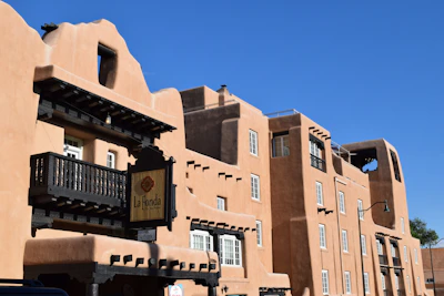 The fiduciapueblo office building bathed in warm afternoon light in the heart of the pueblo.