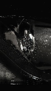 Before-and-after view of a headlight restored to crystal-clear brightness from dull and foggy.