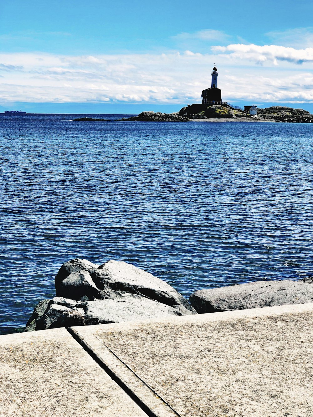 landscape photo of a gray lighthouse