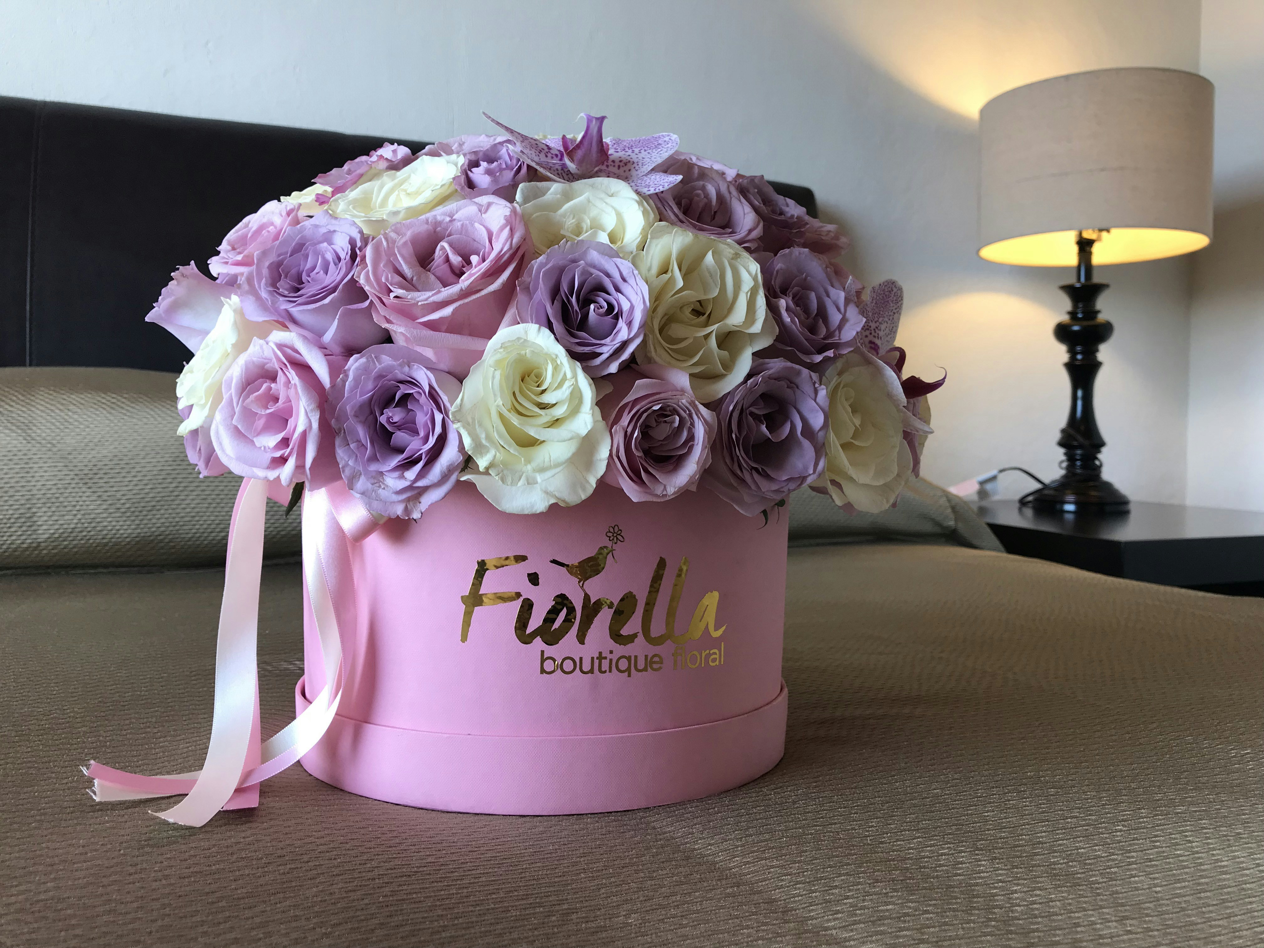 Champagne roses and cream lisianthus in a luxury hat box arrangement