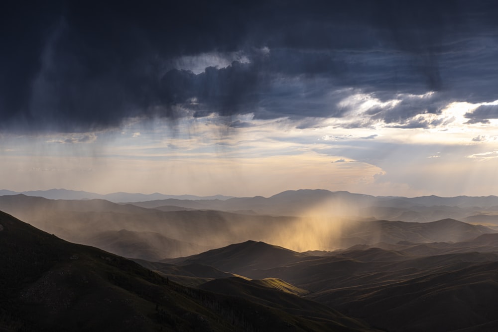 mountains and clouds during day