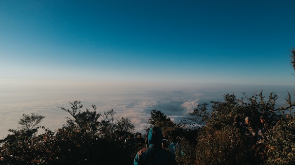 Groups enjoying a scenic mountain getaway with clear blue skies.