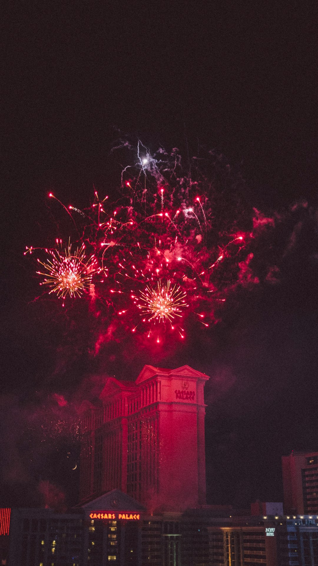 fireworks on top of high-rise building