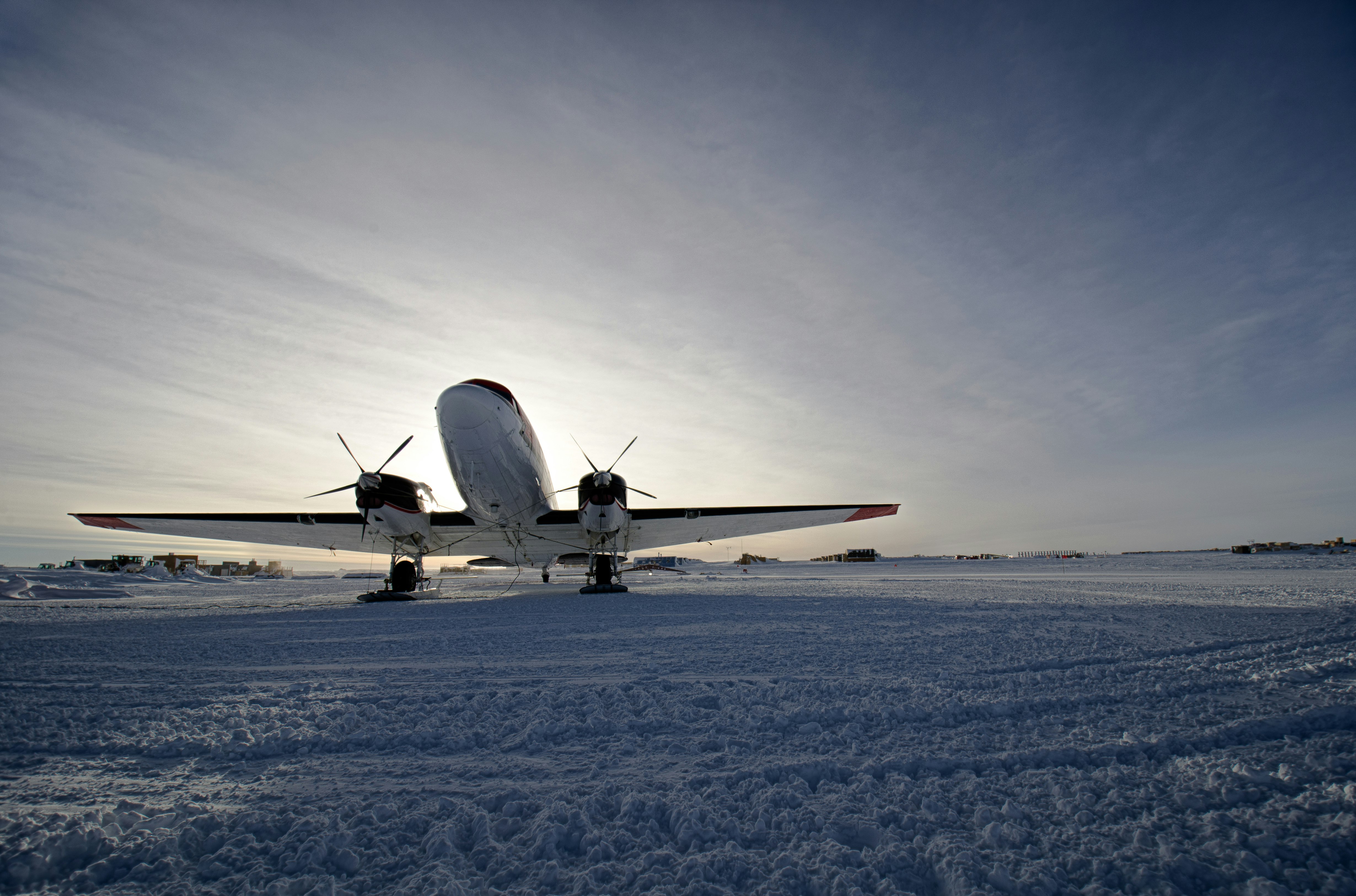 Small U. S. Antarctic Program aircraft on the tarmac at South Pole Station. Note skis