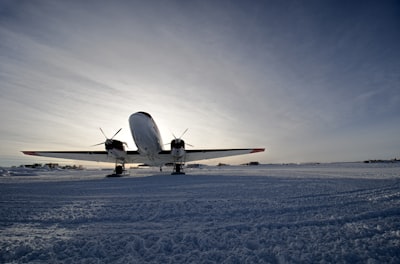 white airplane on runway during daytime south sudan google meet background