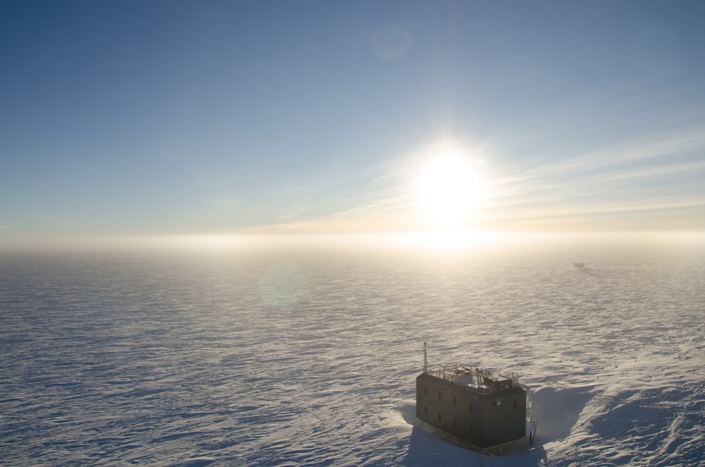 aerial photo of building on snow field